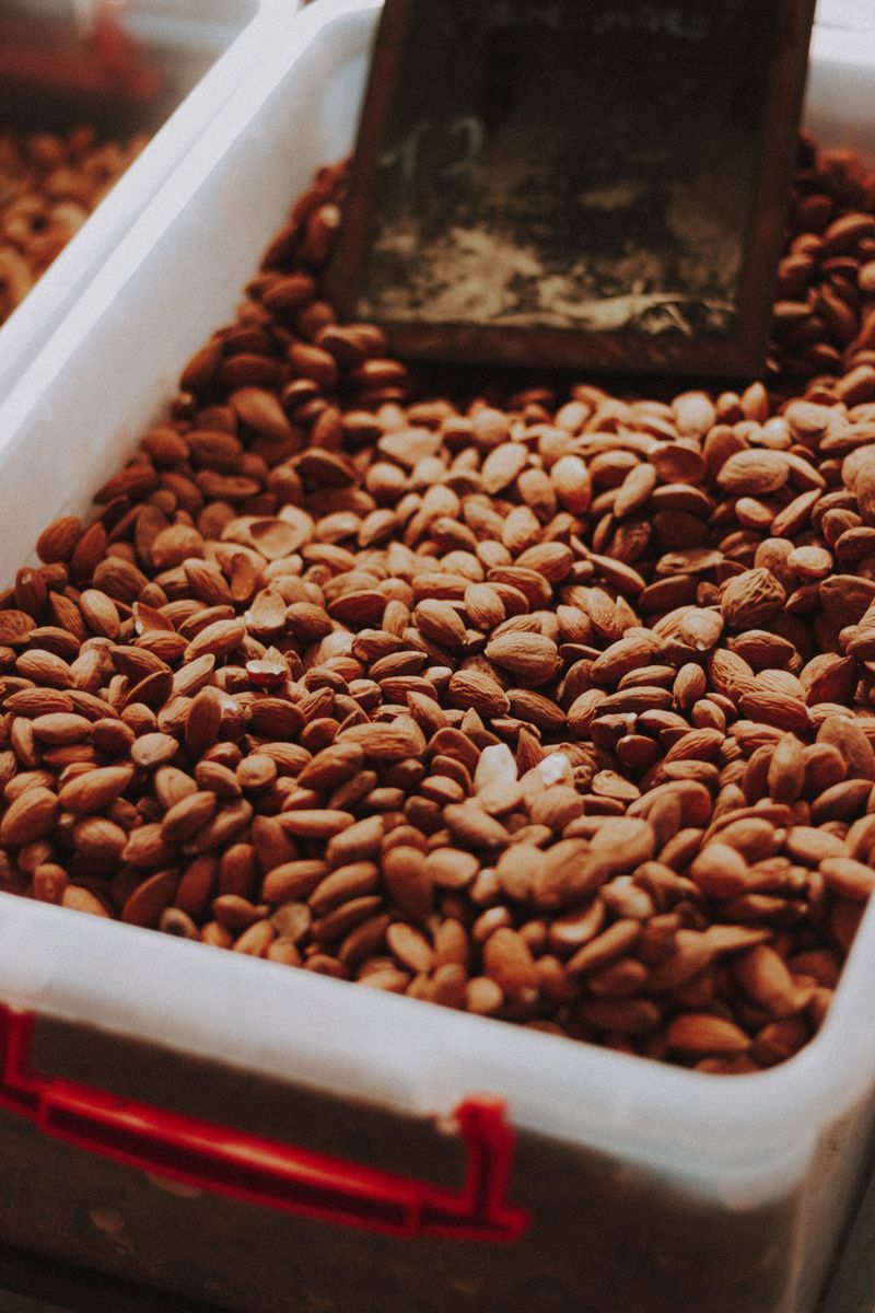 Detailed close-up of brown raw almonds showcasing texture and natural appearance.