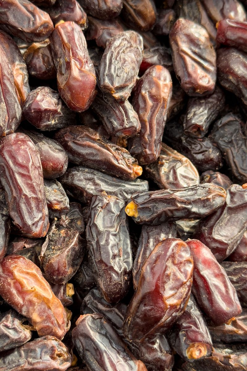 A detailed close-up of fresh Medjool dates, showcasing texture and freshness.